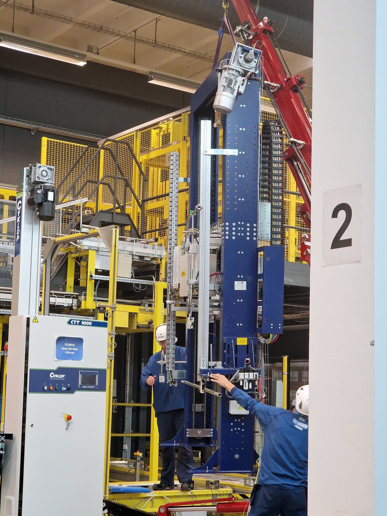 Mechanical installation of an industrial machine with a crane