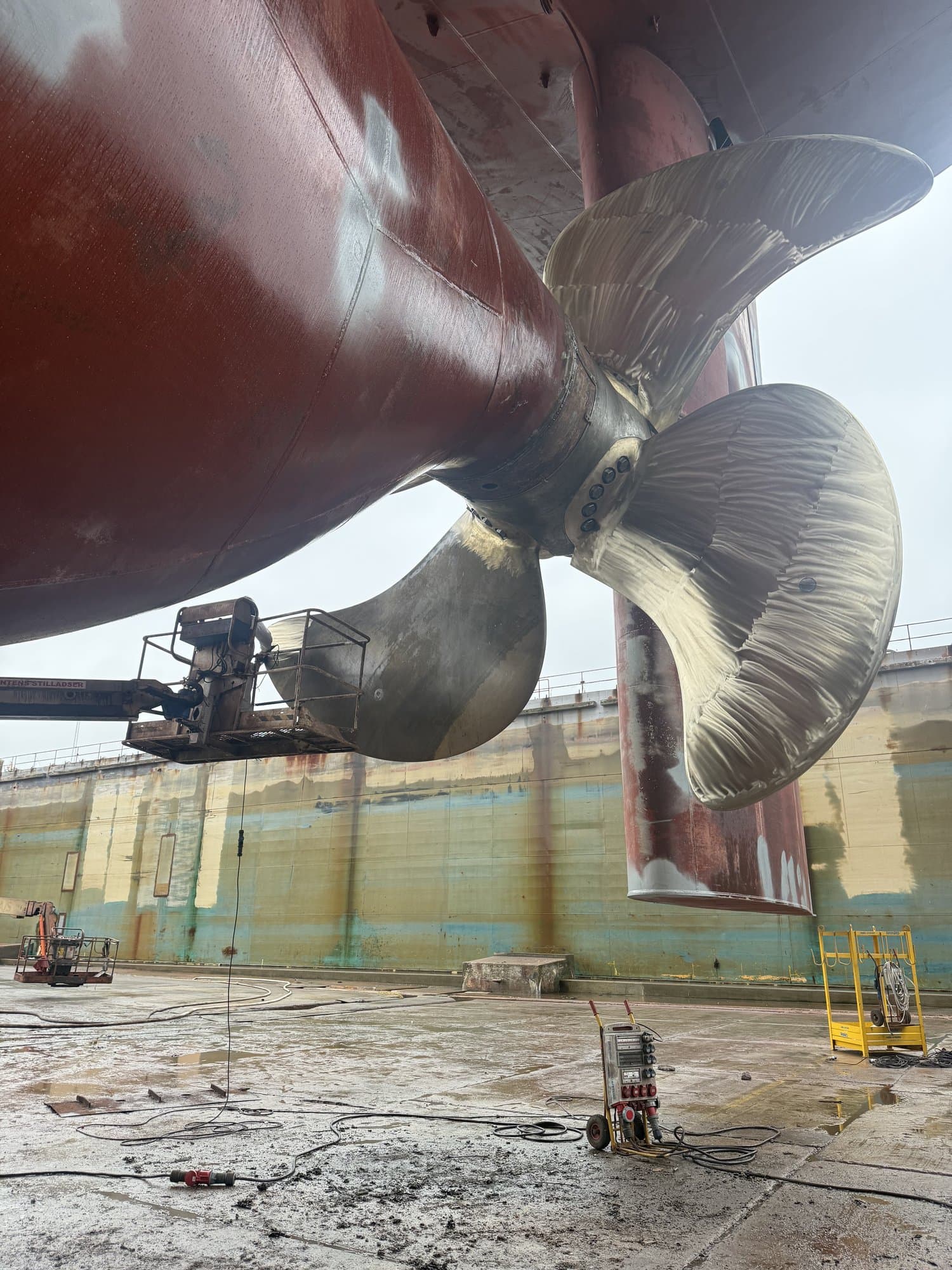 Close-up of a bronze propeller in dry dock